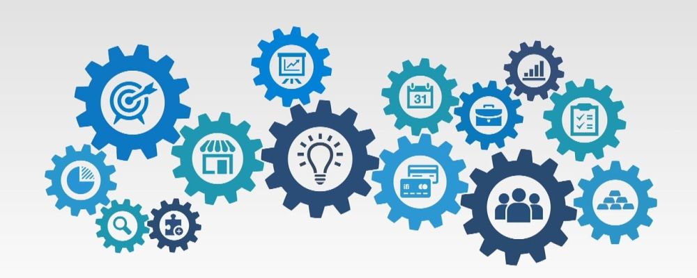 Bildhafte Darstellung von Zahnrädern mit verschiedenen Symbolen